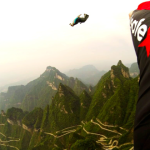 a person flying over a mountain