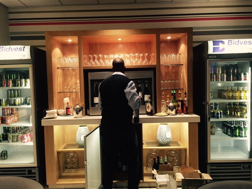 a man standing at a bar