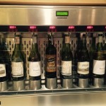 a group of wine bottles in a machine