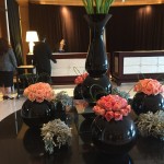 a group of vases with flowers on a table