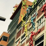 a building with many colorful figures on the side