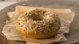 a bagel with seeds on top