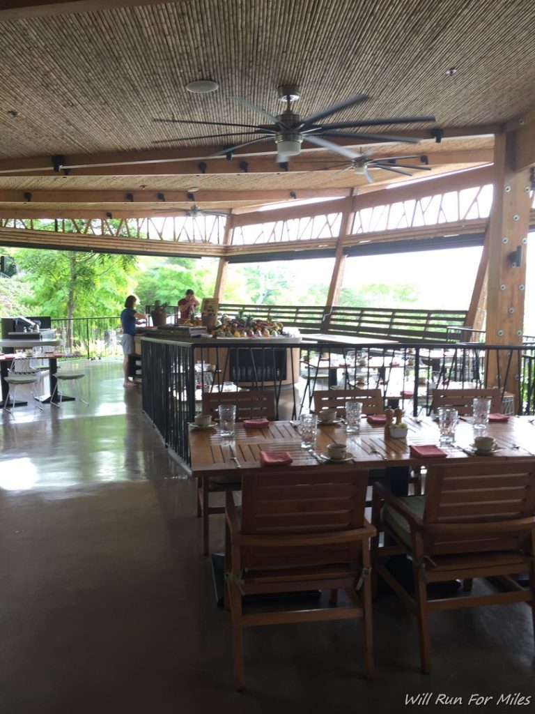 a restaurant with a large table and chairs