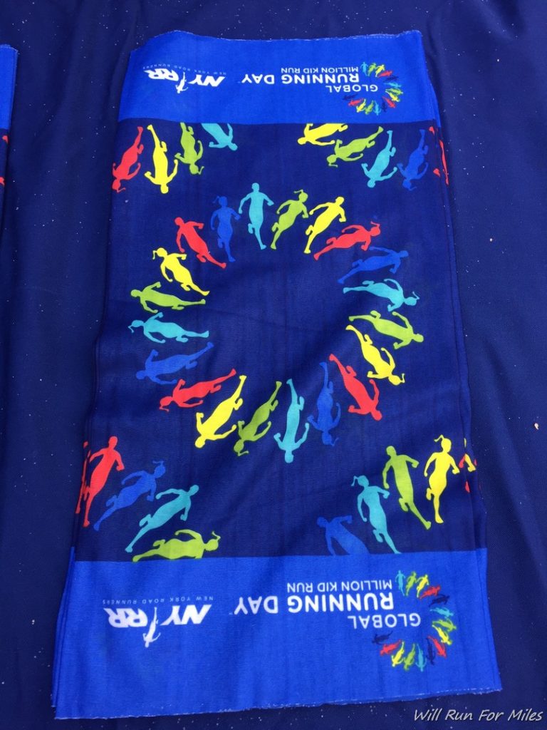a blue towel with colorful figures on it