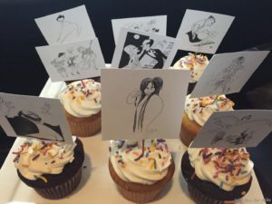 a group of cupcakes with pictures of people on them