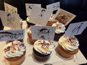a group of cupcakes with pictures on them
