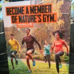 a poster of a group of people running