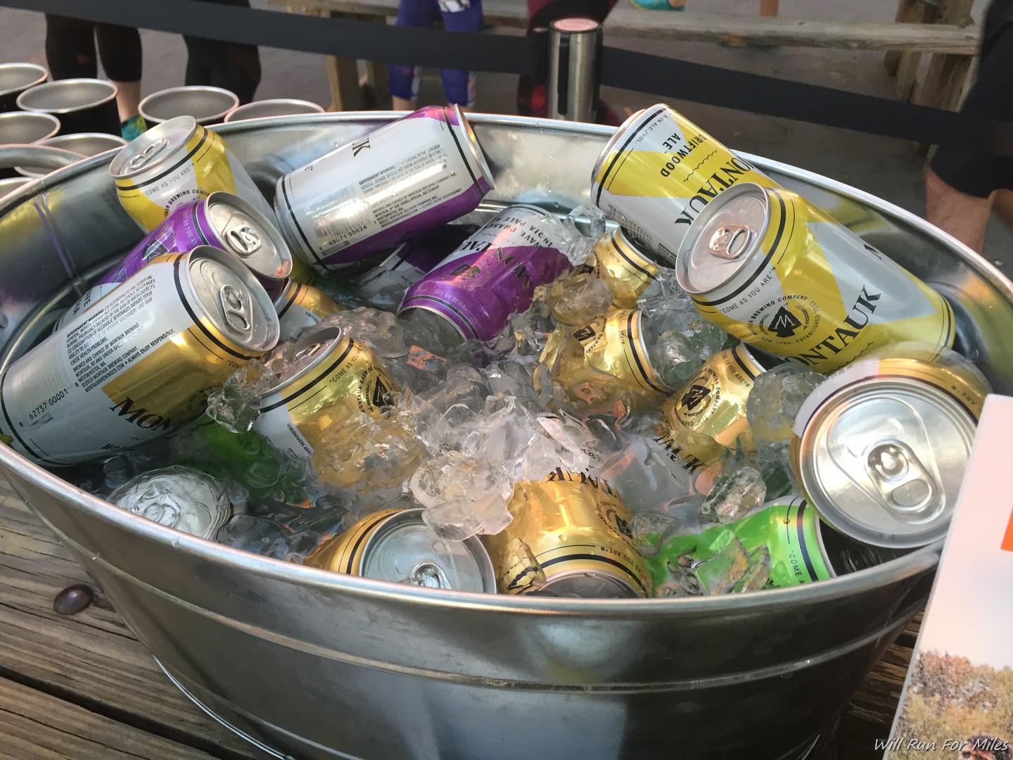 a bucket of cans and ice
