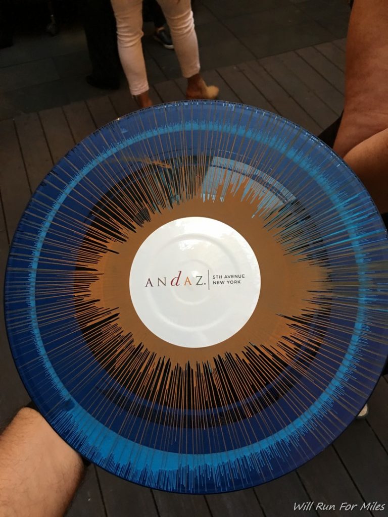 a blue and brown plate with text on it