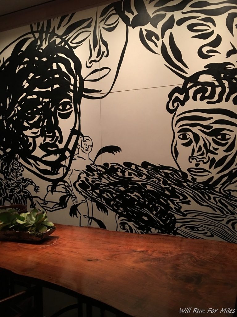 a black and white drawing on a wall