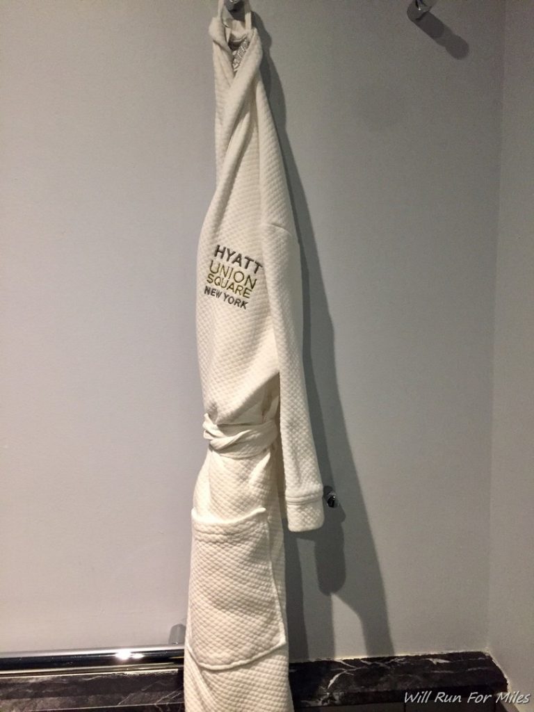 a white robe on a hook