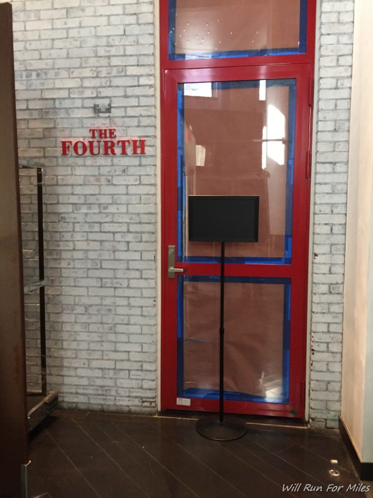a red door with a screen on it