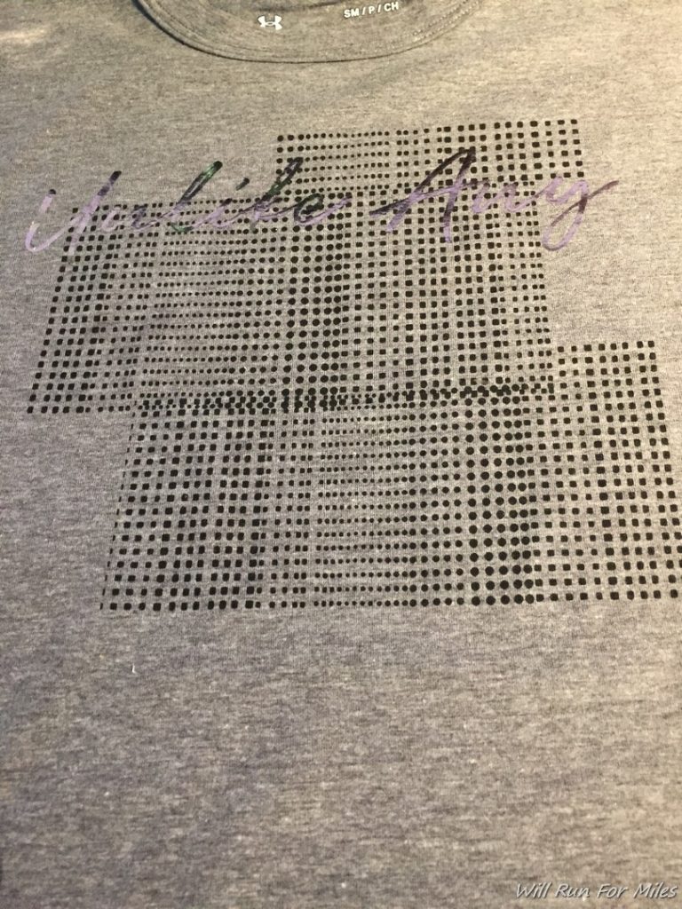 a grey t-shirt with black dots