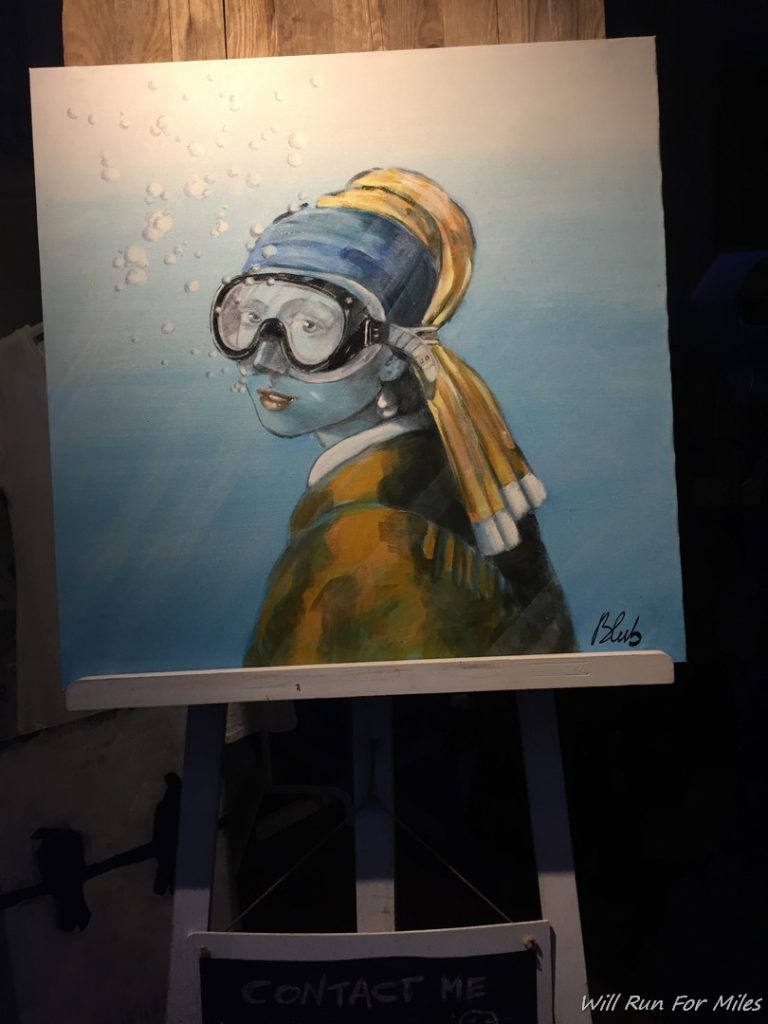 a painting of a woman wearing goggles