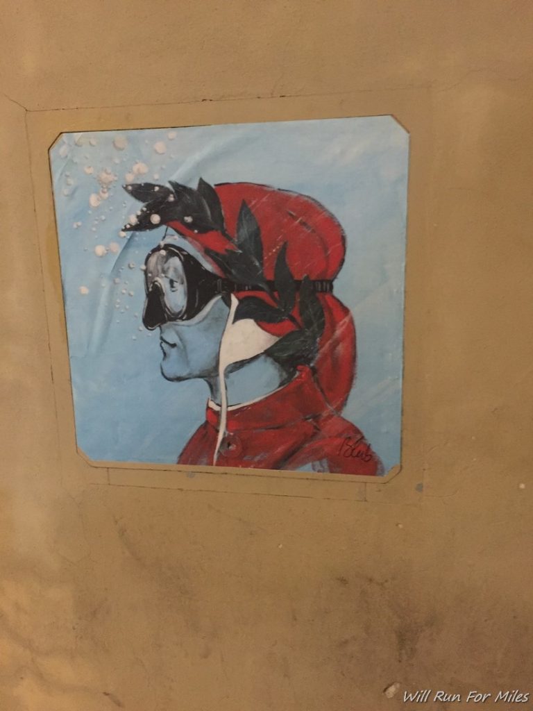 a painting of a man wearing a red hat and goggles