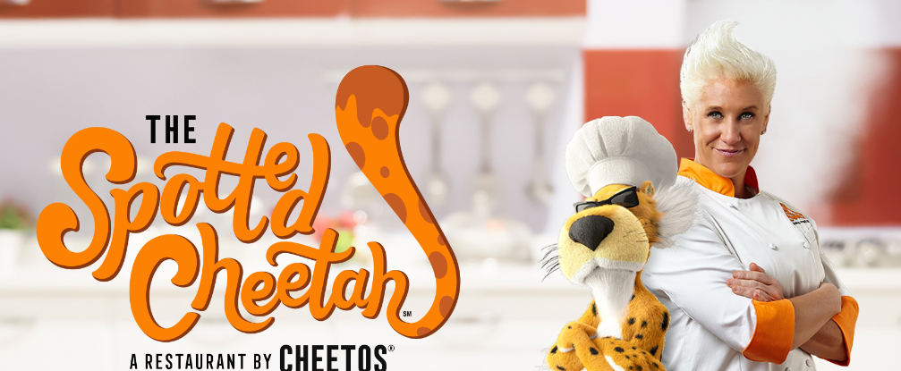 a stuffed cheetah wearing a chef hat