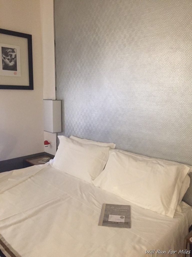 a bed with a book on it