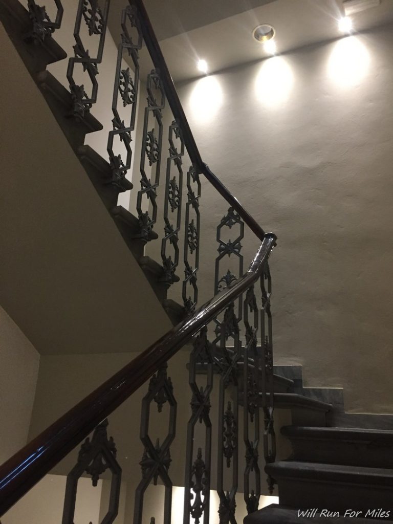 a staircase with a metal railing
