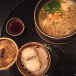 a bowl of soup and dumplings