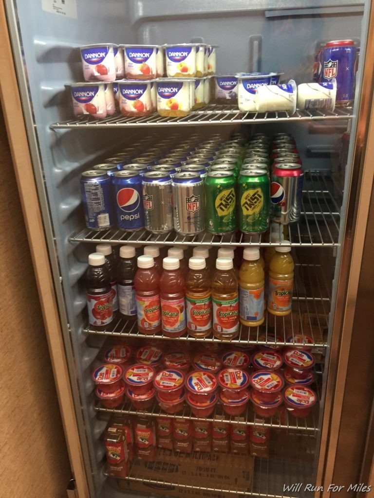 a refrigerator full of drinks and beverages