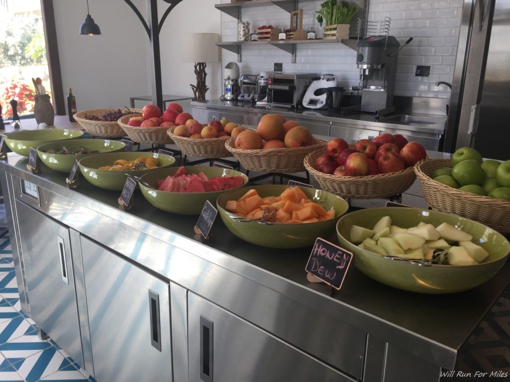 a group of bowls of fruit on a counter