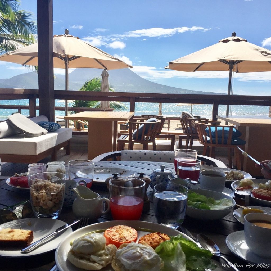 a table with food on it and a view of the ocean