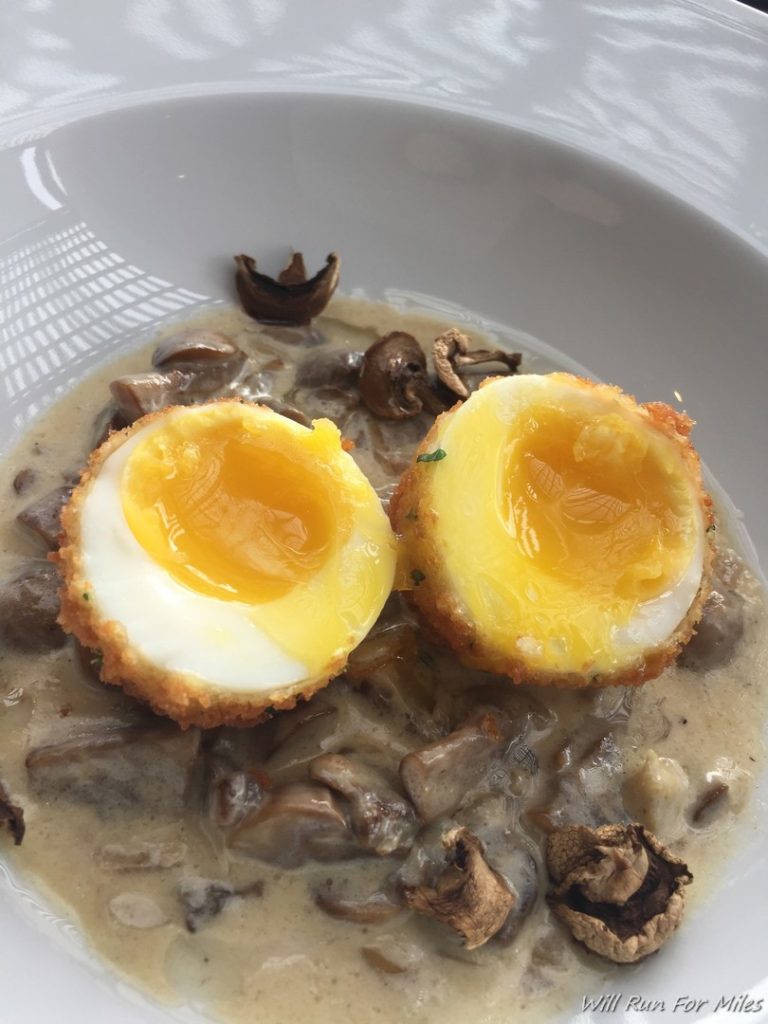 a plate of food with eggs and mushrooms