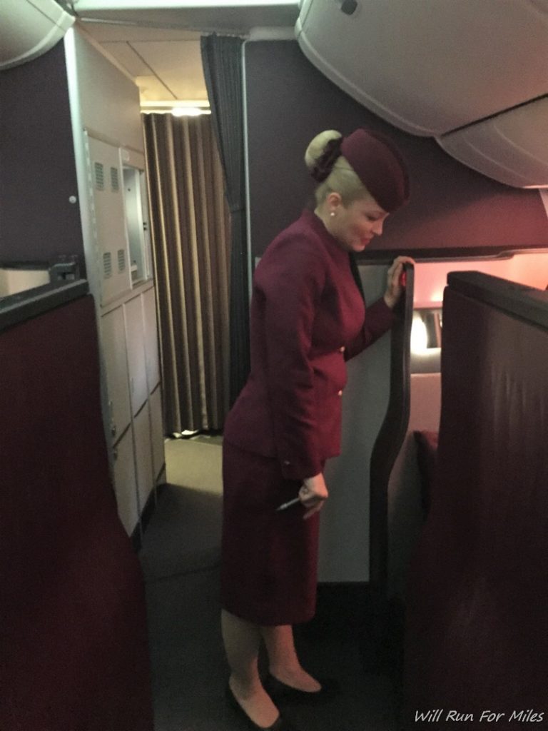 a woman in a maroon suit