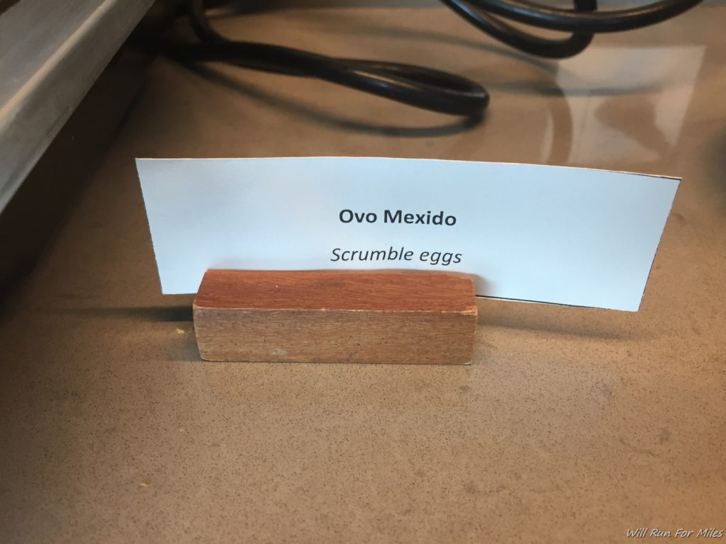 a wood block with a piece of paper on a table