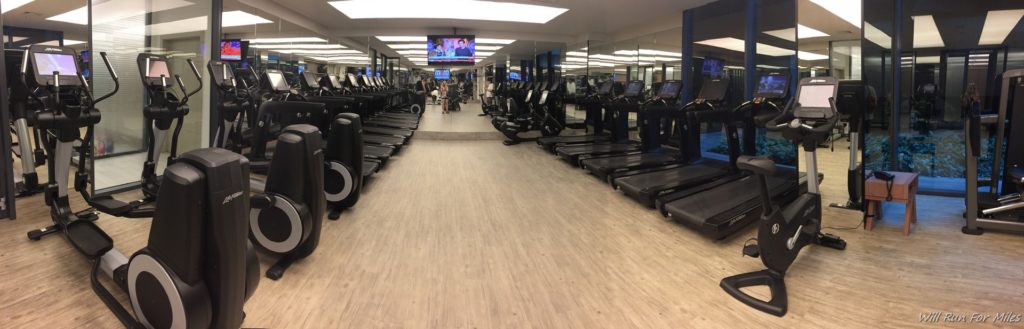 a gym with treadmills and treadmills