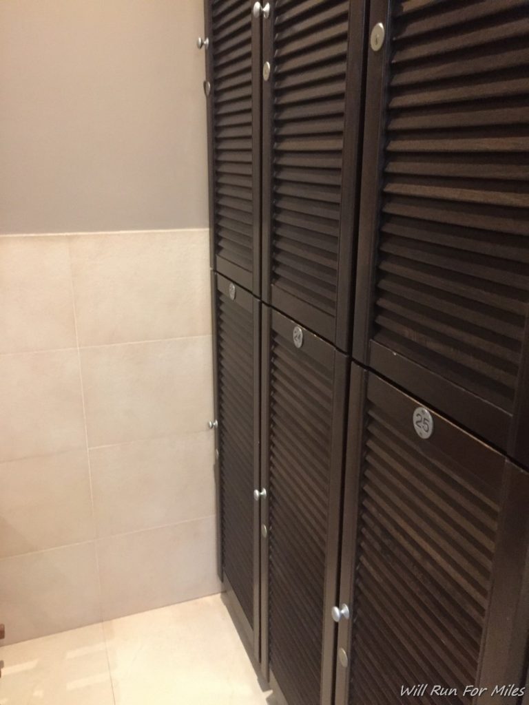 a row of dark wooden lockers
