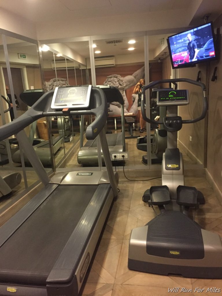 a treadmills and a tv in a room