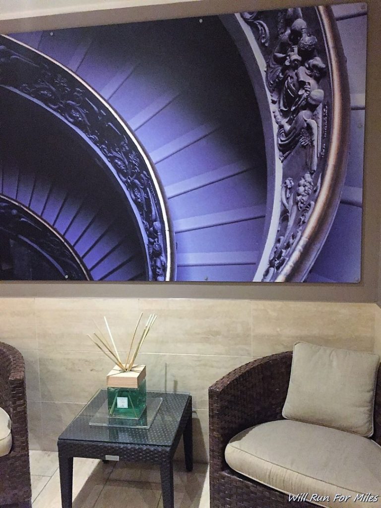 a room with a picture of a round object on the wall