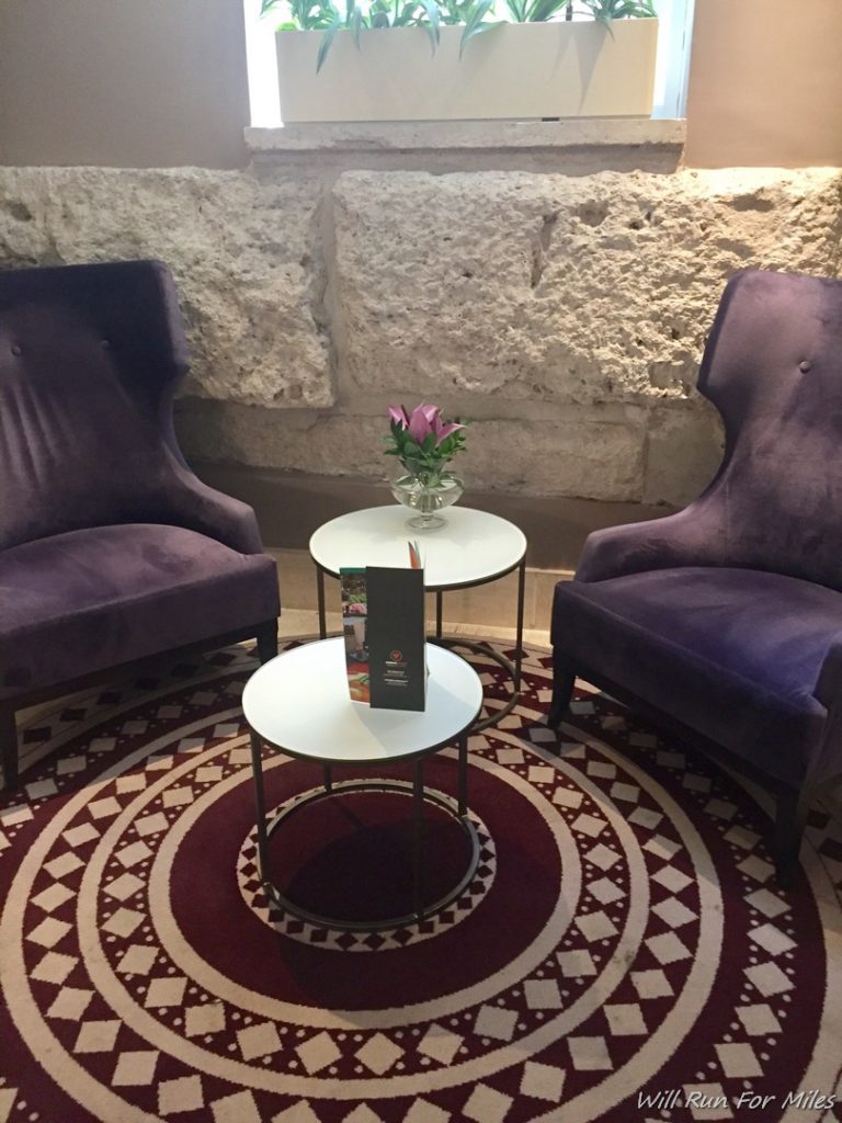 two purple chairs on a round table