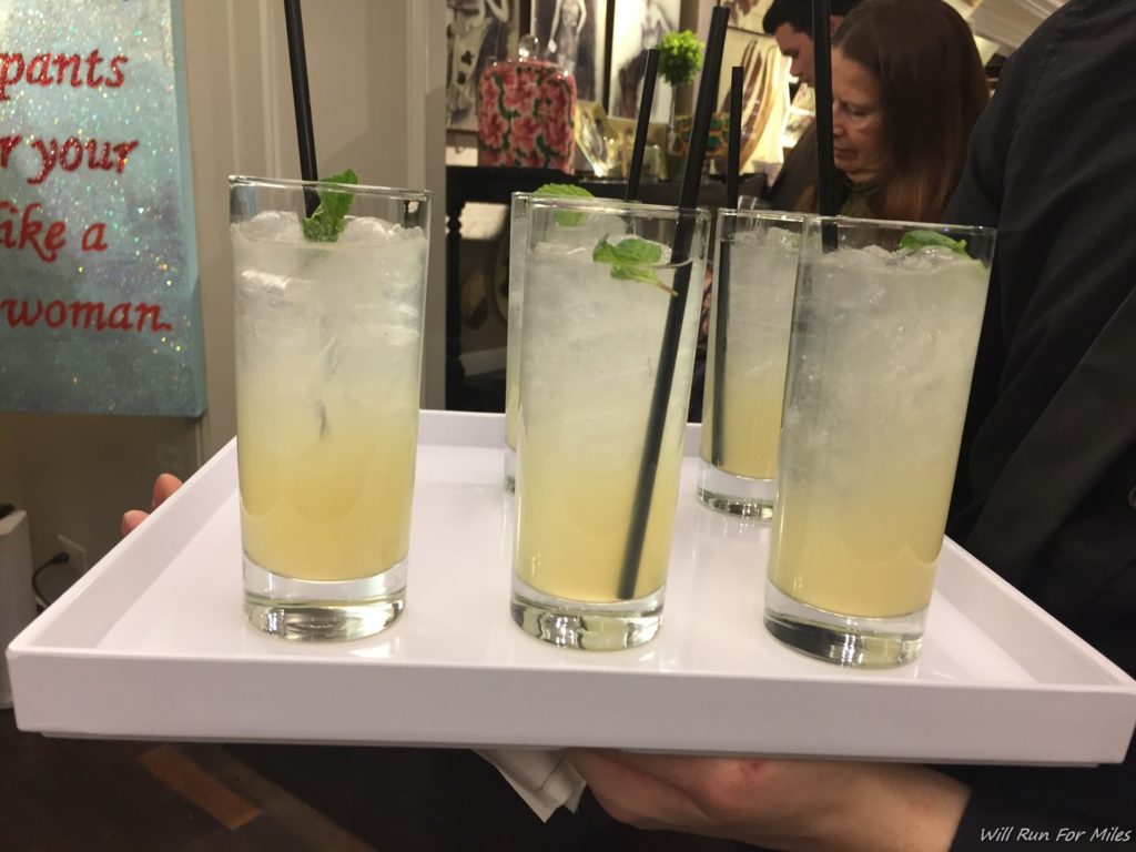 a tray of drinks with straws
