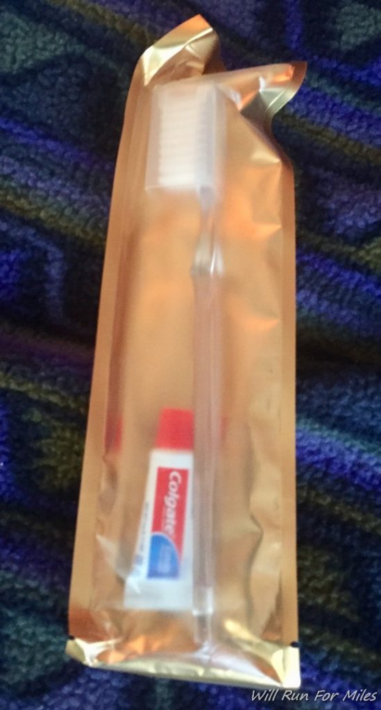 a toothbrush and toothpaste in a plastic bag
