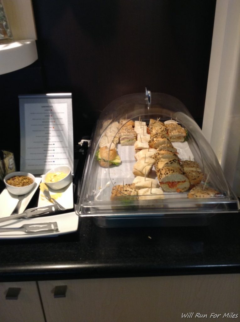 a tray of sandwiches and other food