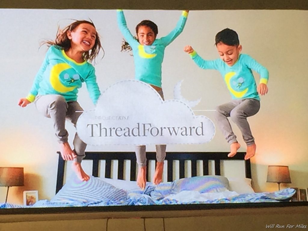 a group of children jumping on a bed