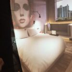 a bed with a picture of a woman's face