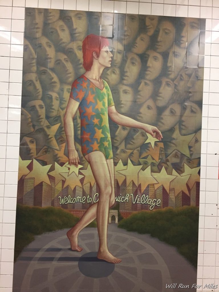 a poster of a man walking on a tiled wall