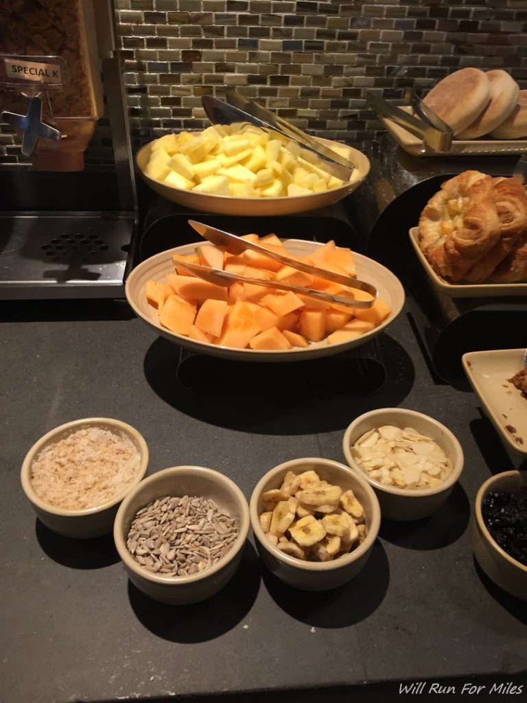 a buffet table with bowls of food