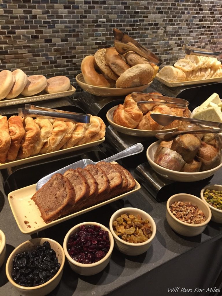 a variety of bread and pastries on a counter