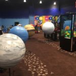 a room with balls and arcade game machines