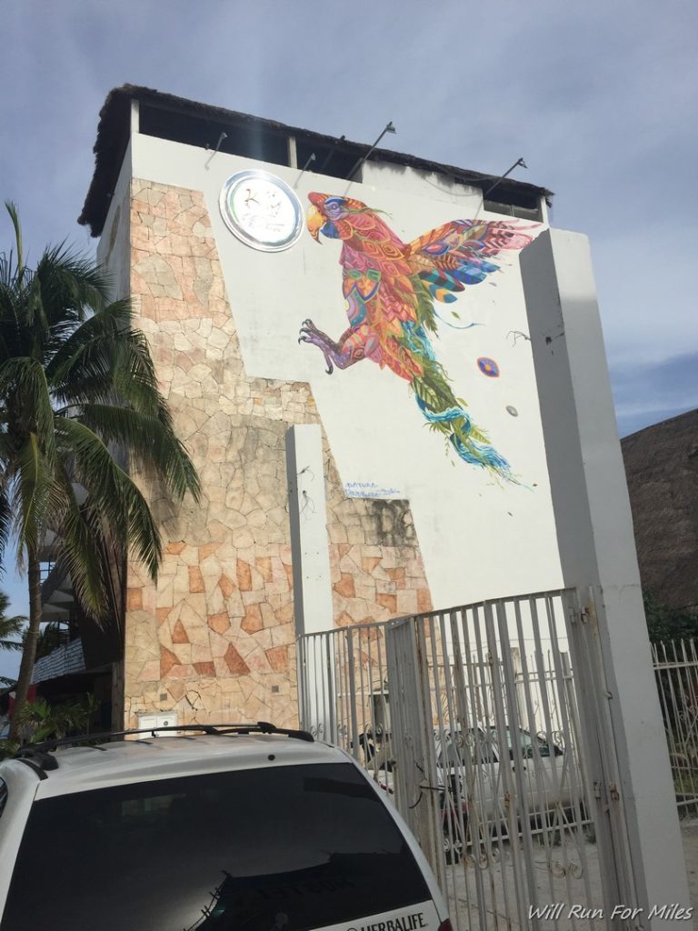 a building with a mural of a bird