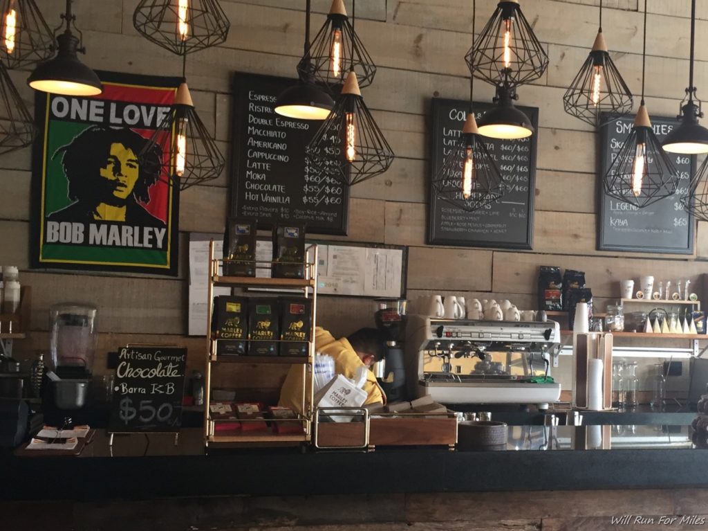 a coffee shop with a counter and signs