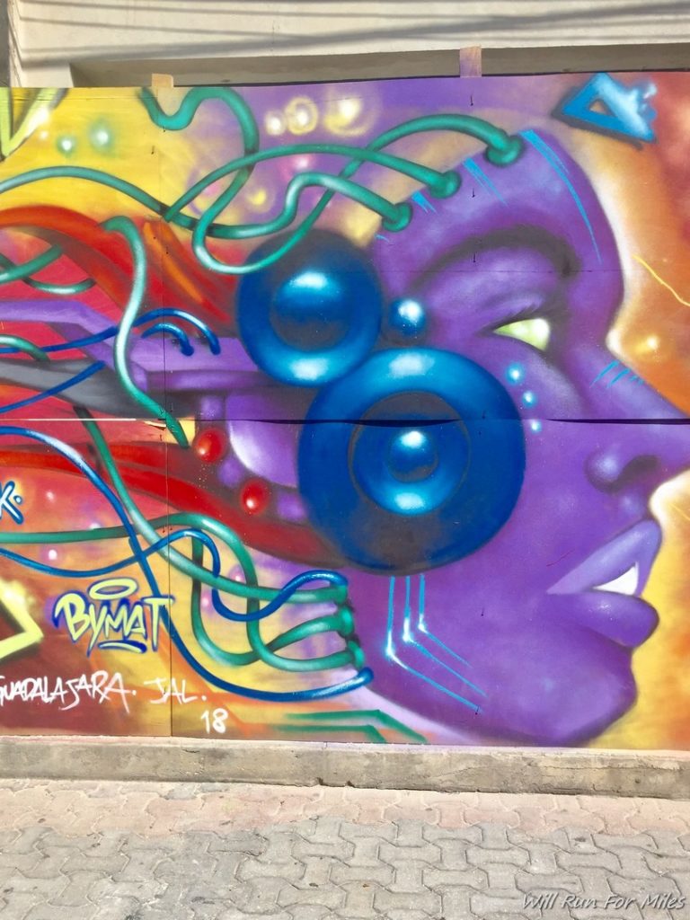 a colorful graffiti on a wall