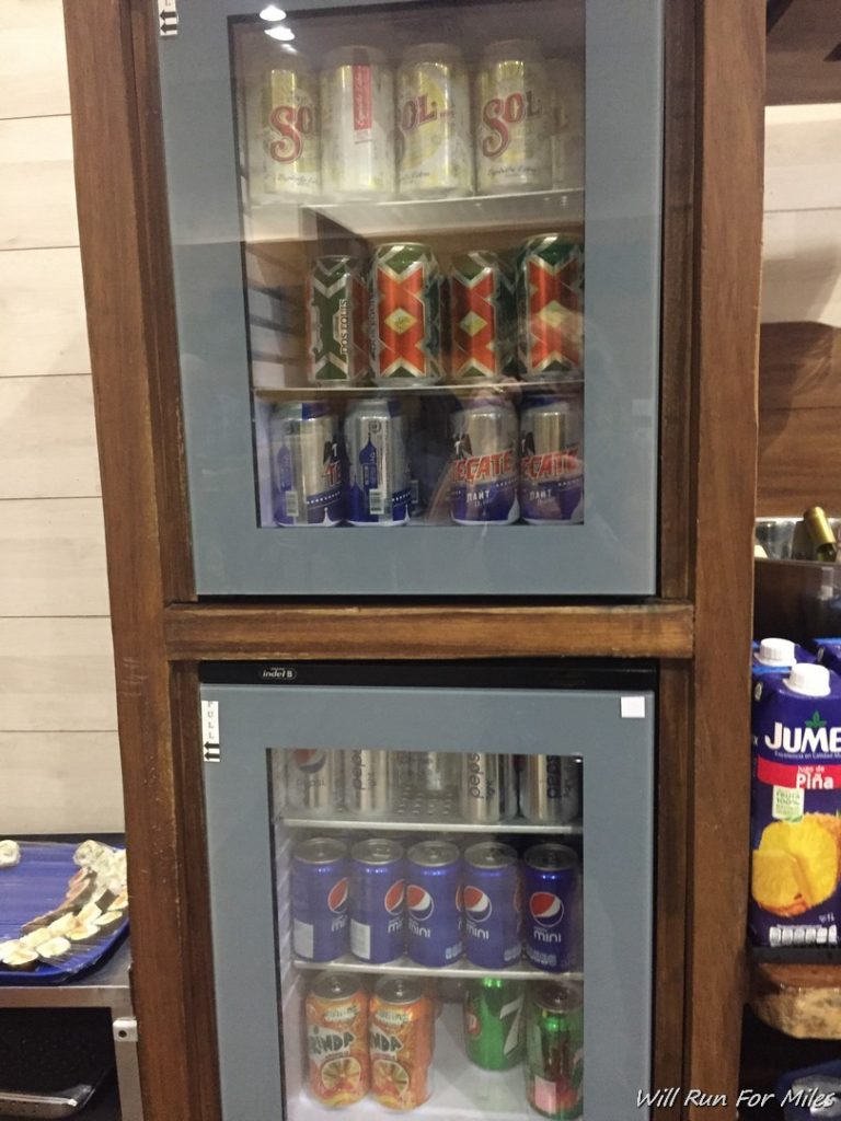 a beverage cabinet with cans and cans in it