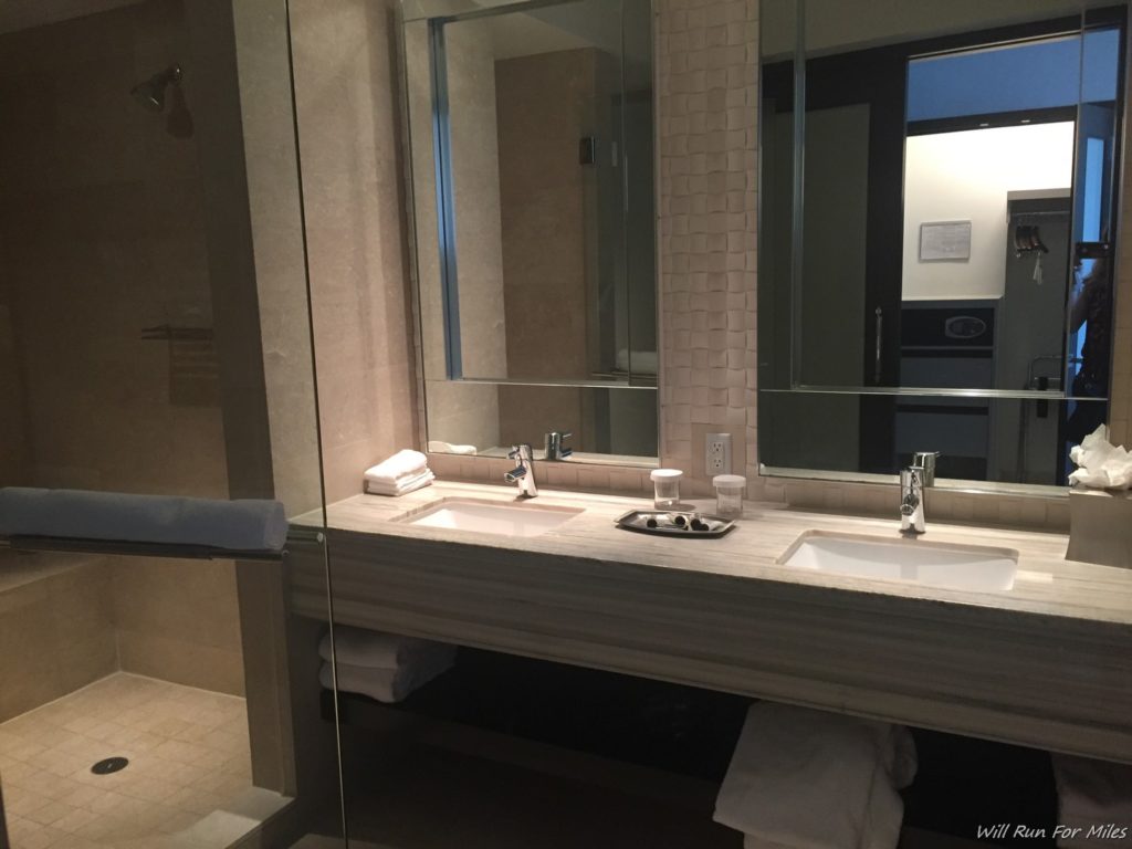 a bathroom with a large mirror and sinks