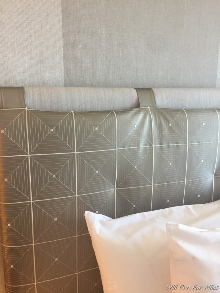 a bed with a pillow