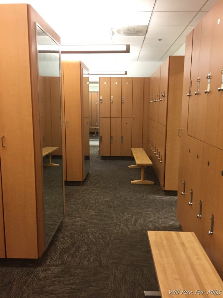 a locker room with a bench and lockers
